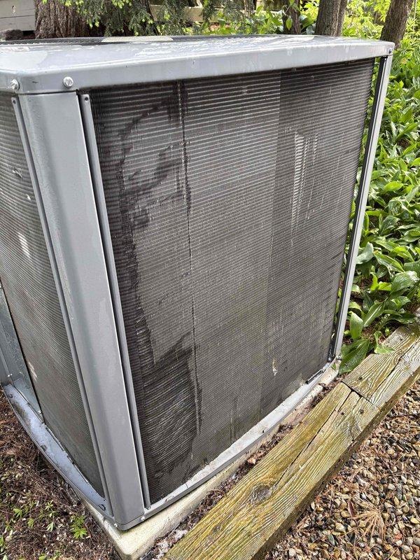 Completed annual cooling maintenance on 16-year-old Allied air conditioning system. Upon arrival, found outdoor condenser unit heavily soiled with significant accumulation of dirt, dust, and dried plant debris including vines draped across coil surfaces. Cleared all organic matter and debris from condenser coil and surrounding unit. Performed thorough coil cleaning to restore proper airflow and heat transfer efficiency. Inspected unit components, verified system operation, and confirmed equipment functioning properly following maintenance procedures.