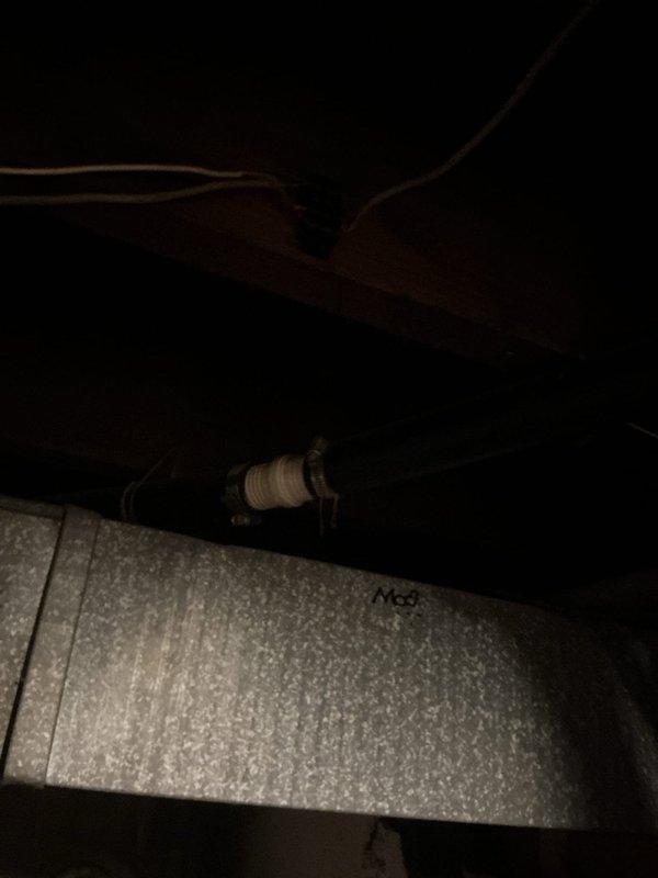 Responded to plumbing leak complaint with water intrusion into crawlspace originating from kitchen sink drain line. Upon inspection of basement and crawlspace area, located compromised drain pipe beneath kitchen sink with active leak occurring during fixture operation. Water had been infiltrating crawlspace for extended period, evidenced by musty odor that became noticeable with warmer temperatures. Audible water splashing confirmed when kitchen sink was operated. Accessed crawlspace through basement to assess damage extent and locate exact failure point. Documented conditions with photographs showing affected areas including crawlspace access point and basement utility area near laundry equipment. Leak isolated to drain line connection, with no secondary water damage visible in other areas of residence. Provided documentation of findings and repair recommendations to address failed pipe section and prevent continued water intrusion into crawlspace.