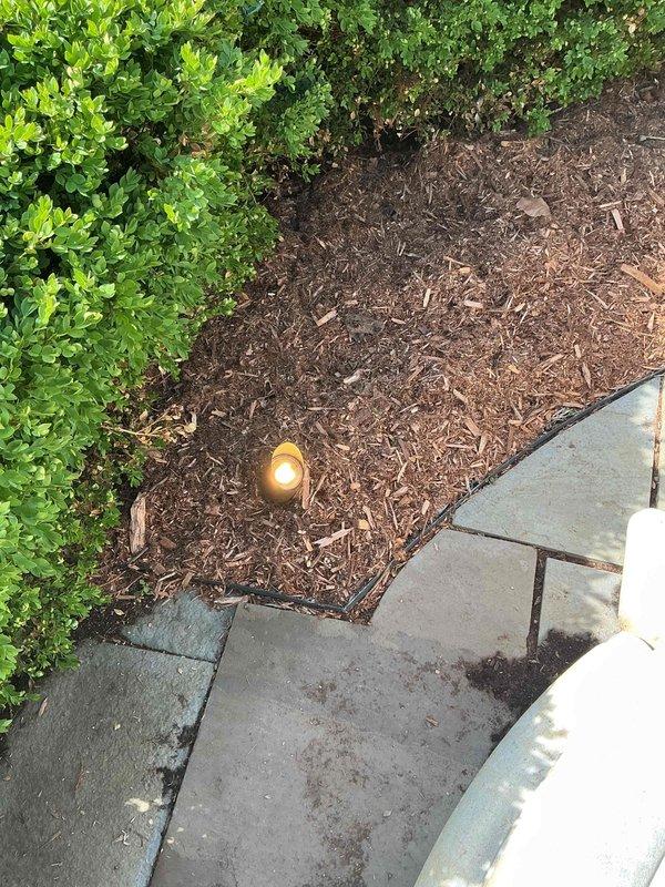 Responded to service call for outdoor lighting system that was previously serviced and had stopped operating correctly. Diagnosed photocell malfunction preventing landscape lights from activating at dusk. Inspected lighting fixtures in landscaped areas including hedge line and walkway zones. Tested photocell sensor and confirmed failure. Replaced defective photocell with new unit and verified proper operation of lighting system. All landscape lights now functioning as designed with automatic dusk-to-dawn operation restored.