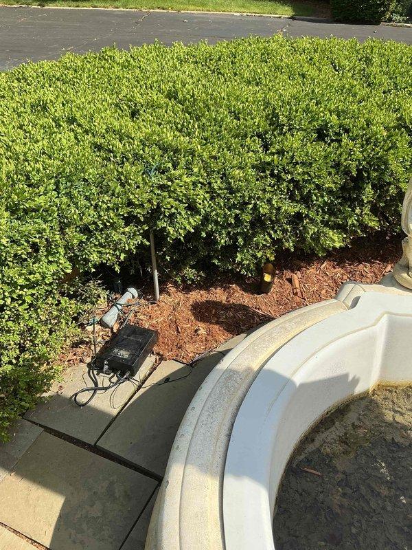 Responded to service call for outdoor lighting system that was previously serviced and had stopped operating correctly. Diagnosed photocell malfunction preventing landscape lights from activating at dusk. Inspected lighting fixtures in landscaped areas including hedge line and walkway zones. Tested photocell sensor and confirmed failure. Replaced defective photocell with new unit and verified proper operation of lighting system. All landscape lights now functioning as designed with automatic dusk-to-dawn operation restored.