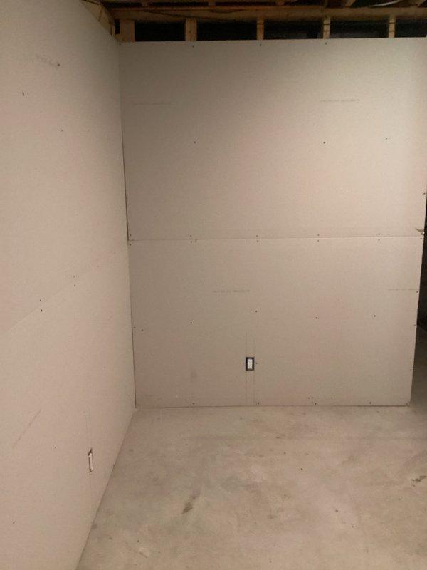 Conducted electrical estimate for installation of 220-volt circuit in residential property. Assessed unfinished basement area with exposed ceiling joists and partial drywall installation to determine optimal routing for new dedicated circuit. Documented existing electrical infrastructure, including current wiring configuration and available panel capacity, to provide accurate scope of work for high-voltage appliance connection.
