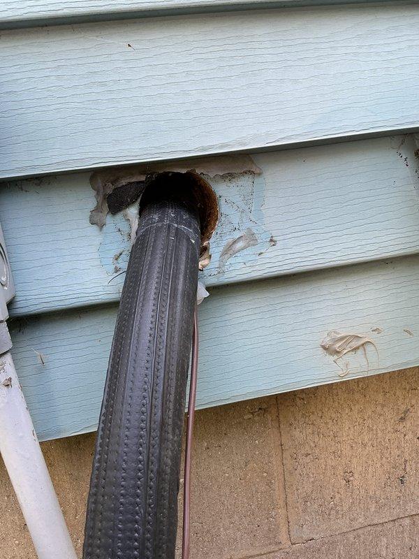 Completed annual AC tune-up and cooling system maintenance on EnergiAir unit under 1-year warranty coverage. Performed standard preventive maintenance procedures including system inspection, performance testing, and documentation. Observed exterior wall penetration for refrigerant lines and condensate drain showing irregular opening with exposed substrate material requiring proper sealing to prevent moisture intrusion and maintain building envelope integrity.