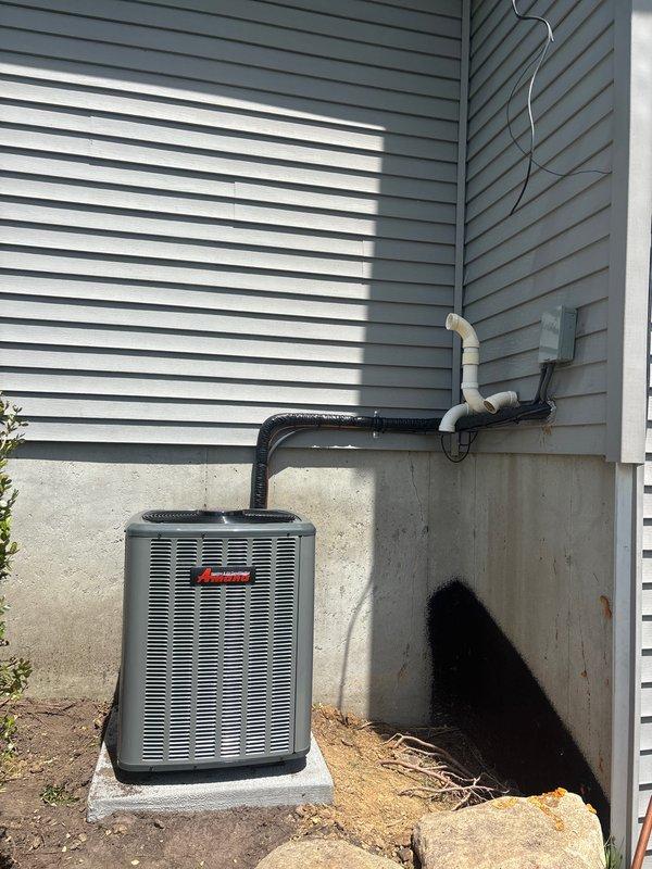 Completed full HVAC system installation including new furnace and air conditioning unit. Installed Amana outdoor condensing unit on concrete pad with proper refrigerant line connections, electrical conduit, and drainage piping. Mounted and connected indoor furnace unit with corresponding air handler, established all necessary PVC venting and condensate drain lines, installed new ductwork connections, and verified proper electrical connections throughout. All equipment tested for proper operation and system commissioned successfully.