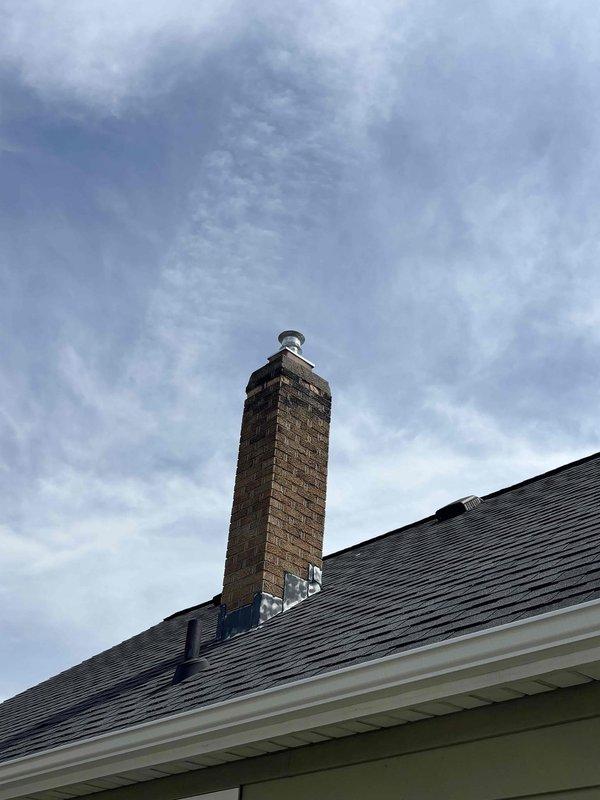 Completed chimney liner installation with proper flashing and weatherproofing at roofline penetration. Installed new stainless steel chimney cap with dome configuration to protect against water intrusion and verified all connections to existing water heater and venting system in mechanical room are secure and functioning properly.