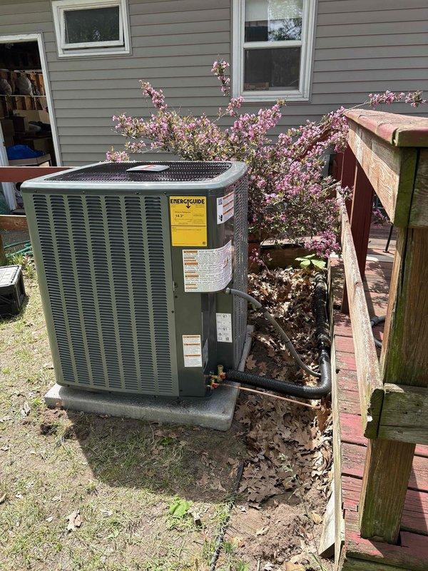Completed full HVAC system replacement including outdoor condensing unit and indoor air handler. Installed new Goodman equipment on existing concrete pad in backyard with proper clearances maintained from landscaping and deck structure. Connected refrigerant lines, electrical service, and condensate drainage to new units, ensuring all connections meet manufacturer specifications and local code requirements.