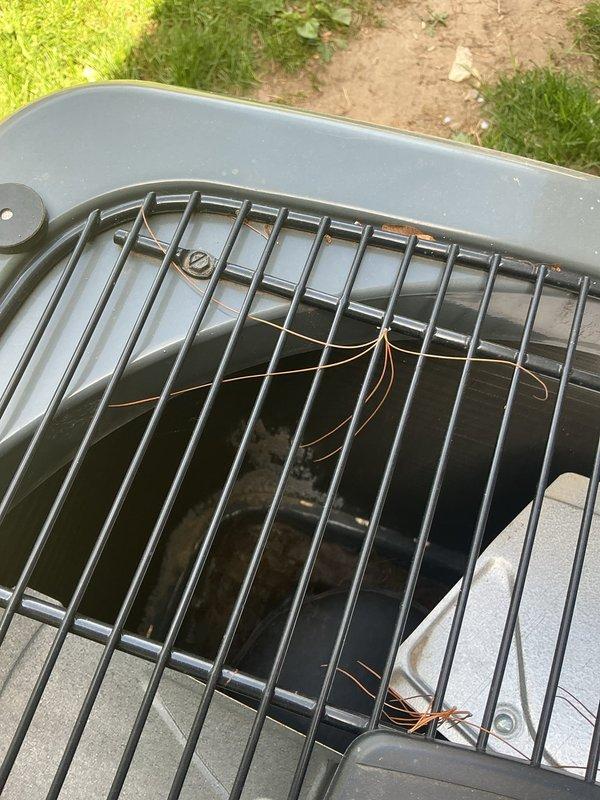 Responded to cooling complaint where system was blowing cool but not cold air affecting entire home. Performed diagnostic evaluation of 2-year-old EnergiAir unit and inspected outdoor condenser assembly, fan operation, and refrigerant lines. Documented equipment condition with photos showing condenser fan guard, internal components, and overall unit status for service records.