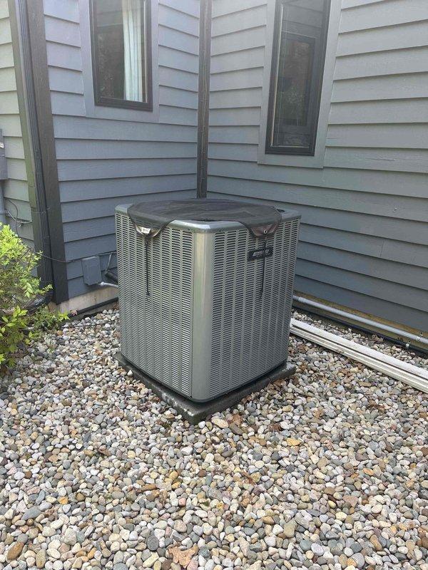 Responded to callback for outdoor unit cleaning concerns following previous maintenance visit. Performed thorough re-cleaning of condenser unit exterior panels, removing accumulated dirt and debris from beige cabinet surfaces. Carefully straightened bent condenser fins using fin comb tool to restore proper airflow and unit efficiency. Verified all sides of unit were properly cleaned, gravel bed maintained, and unit left in satisfactory condition per customer expectations.