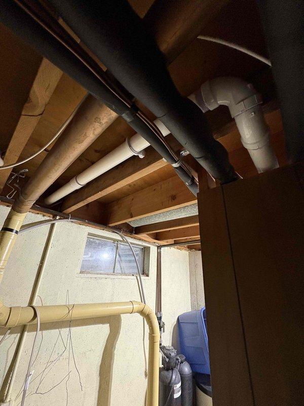 Completed installation of a 50-gallon Power Vent natural gas water heater with 6-inch intake and 6-inch exhaust venting. Utilized temporary power via extension cord to nearby outlet at customer's approval, with dedicated electrical circuit to be installed by electrician at later date. Verified proper venting through exterior wall with PVC piping, confirmed all connections secure, and ensured unit operational before departure.