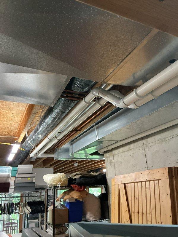 Responded to no heat call on one-year-old EnergiAir furnace. Previous contractor reported unit dropping from high stage to low stage operation due to high stage pressure switch failure and noted venting length exceeded manufacturer specifications. Upon arrival, verified system operation and measured gas pressure at 138" water column using digital manometer. Inspected venting configuration and measured total equivalent length against manufacturer's installation tables. Examined high stage pressure switch operation and electrical connections. Verified all wire terminations, capacitors, and blower motor assembly. Inspected condenser coil cleanliness following previous service visit as requested. Documented system conditions with photos of internal components and venting installation in basement ceiling area. Confirmed proper operation of all safety controls and system staging.