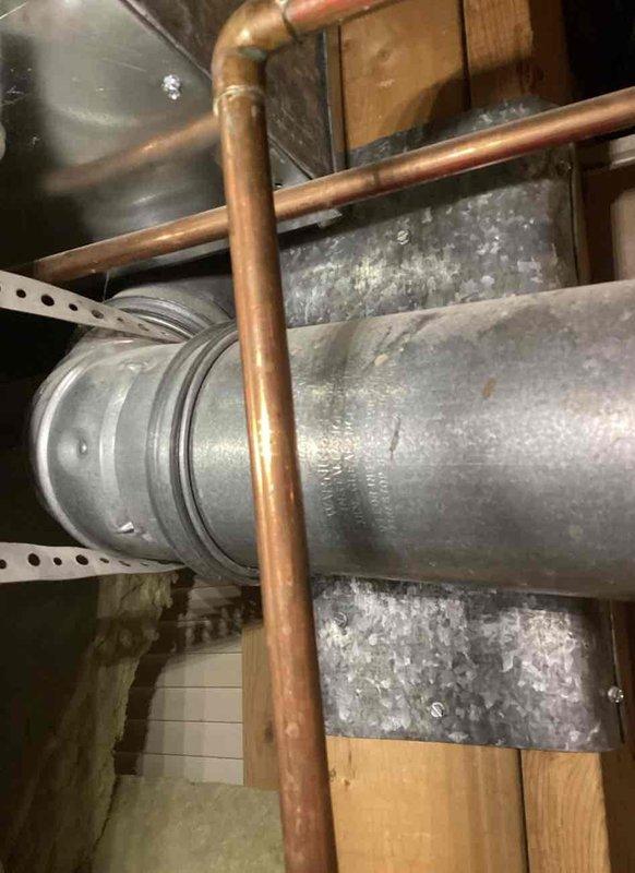 Responded to water heater leak complaint and performed comprehensive inspection of the system. Upon arrival, identified active leak from water heater tank requiring unit replacement. Documented existing dual water heater installation with associated copper piping network, blue-handled shut-off valves, and connection points. Photographed current system configuration including ductwork, plumbing infrastructure, and mechanical components in the utility space. Provided detailed replacement quote to customer for new water heater installation including necessary materials and labor.