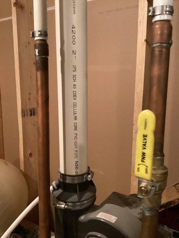 Performed comprehensive assessment of 19-year-old Bradford White water heater for replacement estimate. Evaluated existing plumbing infrastructure including copper supply lines, PVC drainage, main shut-off valve assembly, and mechanical room configuration to provide customer with options for both traditional tank-style and tankless water heater installations.