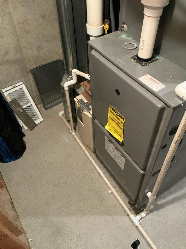 Conducted on-site estimate for furnace and air conditioning system replacement. Assessed existing HVAC equipment in mechanical room, including current furnace unit with PVC venting system and associated ductwork configuration. Documented existing system layout, ductwork conditions, and installation requirements for replacement equipment sizing and specifications.