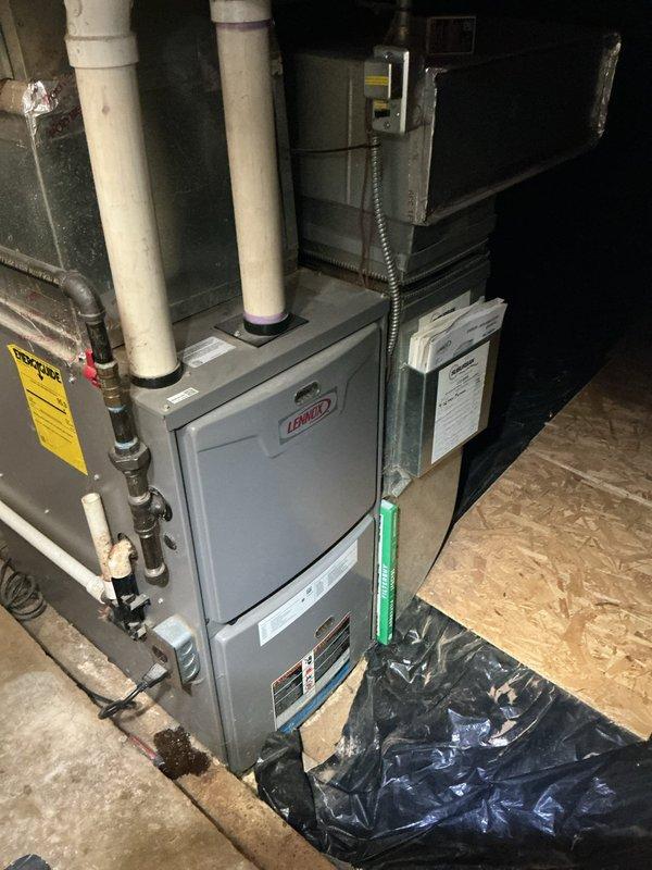 Completed comprehensive AC tune-up on 12-year-old Lennox system with gray air handler/evaporator coil unit installed in basement utility area. Performed standard preventive maintenance protocol including inspection of all mechanical and electrical components, verification of refrigerant levels, testing of system controls and safety devices, and cleaning of accessible components. System operational and running within manufacturer specifications upon completion.