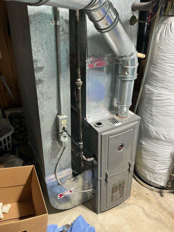 Conducted sales estimate for air conditioning system replacement on 16-year-old existing unit. Inspected basement mechanical room, documented current HVAC equipment configuration including furnace and ductwork system, and photographed installation area to assess accessibility and determine optimal replacement options for customer consideration.