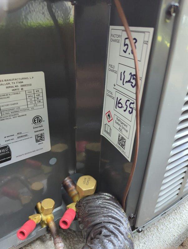 Completed full air conditioning system replacement at residential property. Installed new condensing unit in exterior walkway beneath elevated deck structure, positioning equipment on concrete pad with proper clearances. Connected refrigerant lines with appropriate insulation, installed service valves, and secured condensate drainage line to building exterior wall. Verified all refrigerant circuit connections, charging specifications, and system operation per manufacturer requirements.