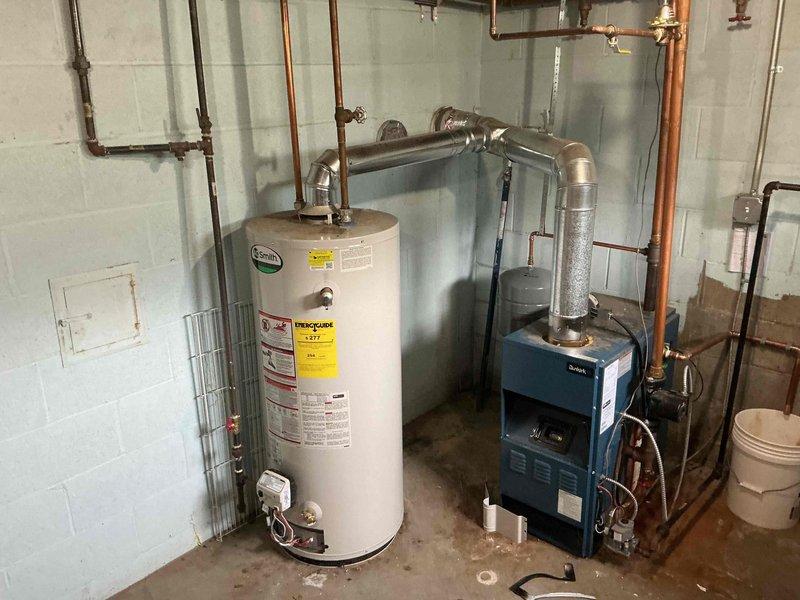 Responded to no-ignition complaint on 15-year-old residential water heater. Customer had previously replaced thermocouple without resolving issue. Confirmed gas supply present and spark generation occurring at pilot assembly. Performed diagnostic testing and determined gas control valve failure preventing proper gas flow to pilot and main burner despite adequate spark and thermocouple function. Recommended water heater replacement due to age of unit and cost-effectiveness compared to repair of failed gas valve on older equipment.
