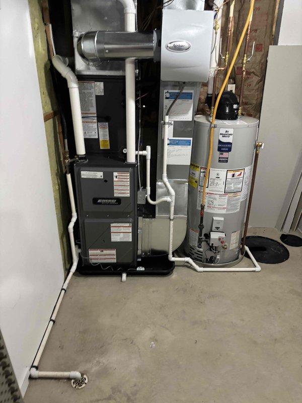 Completed full HVAC system installation including new furnace and air conditioning unit. Installed outdoor condensing unit on concrete pad with proper refrigerant line connections, electrical disconnect box, and PVC condensate drainage piping. Indoor installation included new furnace unit with associated ductwork connections, PVC venting system, and all required electrical and gas connections in mechanical room. All equipment properly mounted, leveled, and secured per manufacturer specifications. System tested and verified operational.