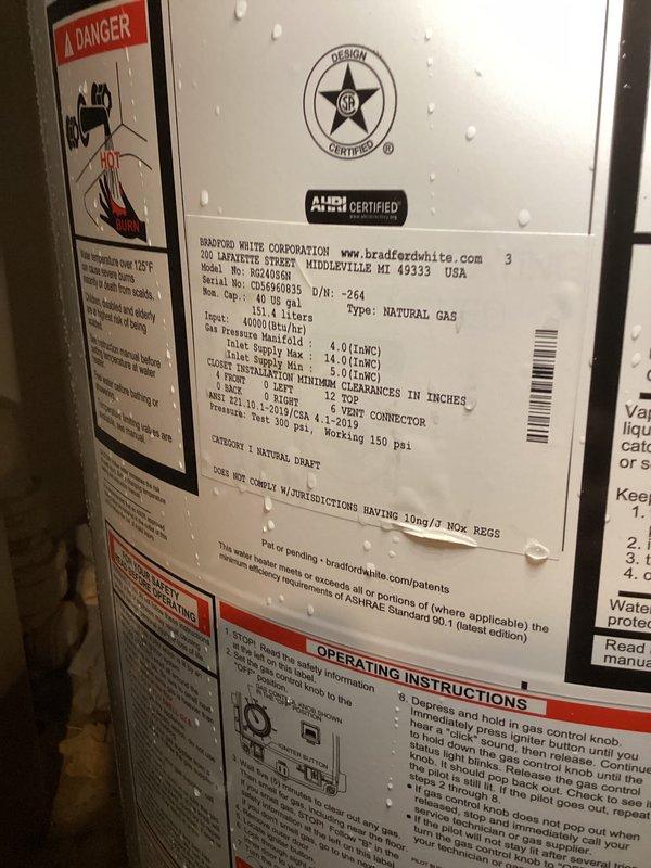Installed a 40-gallon natural draft, natural gas Bradford White water heater (short tank model, 48 1/16" height) in basement utility area. Connected copper supply and discharge piping to unit, installed pressure relief valve with proper discharge piping, and integrated existing expansion tank into the system. Unit is covered by 6-year parts and 1-year labor warranty and is fully operational.