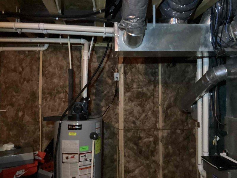 Provided estimate for replacement of existing 9-year-old Lochinvar tank water heater with new tankless water heater system in single-family residential property. Current unit is original to home construction and shows no active failures, leaks, or operational issues. Assessed existing installation including plumbing connections, venting configuration, electrical requirements, and available space in basement utility area to determine scope and feasibility of tankless conversion.