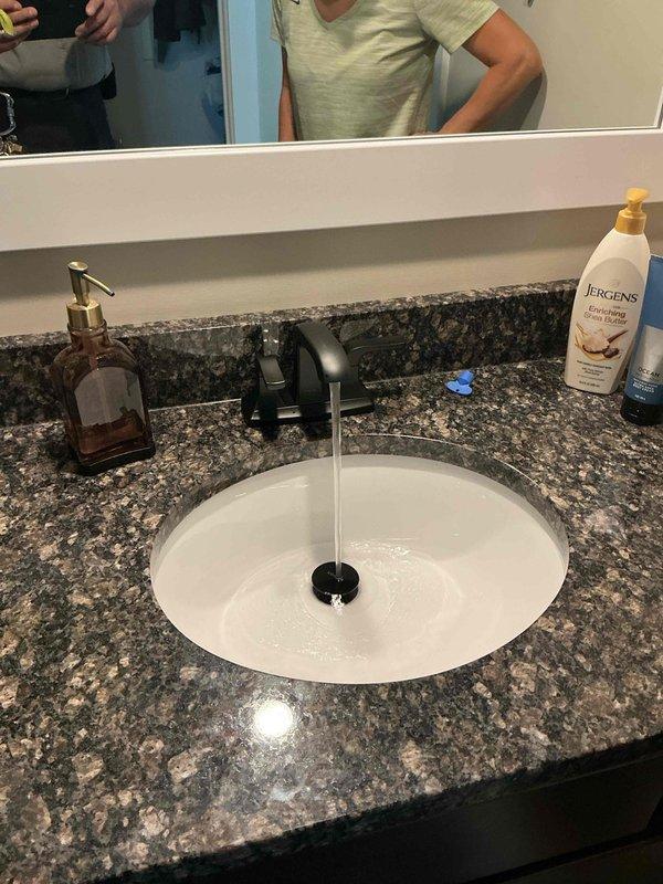 Successfully replaced two bathroom sink faucets in a 13-year-old custom-built residence and repaired a leaking hose spigot. Installed modern single-handle faucets with curved spout designs in oil-rubbed bronze and matte black finishes on granite vanity countertops with undermount sinks. All fixtures tested for proper water flow and verified leak-free operation upon completion.