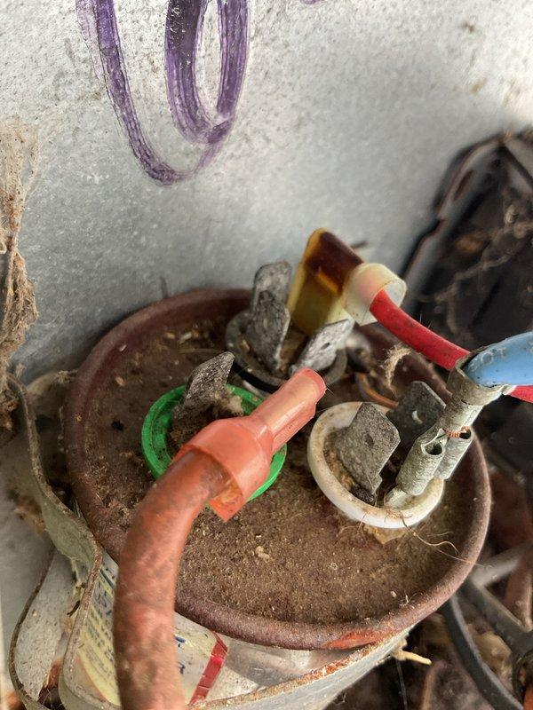 Responded to no cooling complaint on 36-year-old Tempstar system original to home. Upon arrival, found unit completely non-operational with extensive deterioration throughout. Exterior condenser showed significant debris accumulation with leaves, twigs, and organic material collected inside cabinet and around internal components. Electrical connections displayed severe corrosion and rust on junction box, wiring terminations, and capacitor connections. Internal wiring exhibited age-related degradation with compromised insulation integrity. Given the advanced age of equipment at over three decades old, extreme corrosion of electrical components, and complete system failure, recommended full system replacement as most cost-effective solution. Unit has exceeded its expected service life and presents safety concerns due to deteriorated electrical connections and compromised wiring. Customer advised that repair costs would not be justified on equipment of this age and condition.