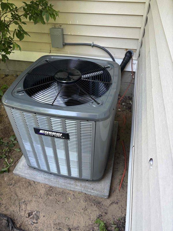 Completed full air conditioning system installation at residential property. Installed new outdoor condenser unit on concrete pad in side yard, positioned between house and fence with proper clearance for airflow and serviceability. Connected electrical service via conduit and disconnect box mounted to exterior wall, ensuring code-compliant wiring and proper grounding. Unit commissioned and tested for proper operation, refrigerant charge verified, and all safety controls confirmed functional.