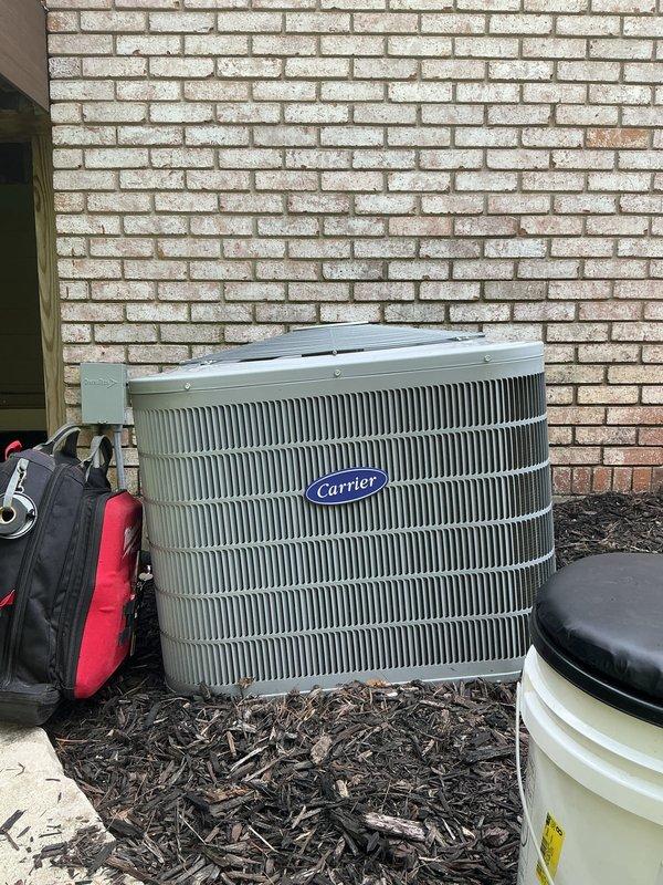 Completed annual cooling maintenance on Carrier air conditioning system per 6-year maintenance agreement. Performed comprehensive system inspection including condenser unit evaluation, electrical connections check, and interior component assessment. Observed moderate to significant corrosion and rust on interior metal surfaces and housing components, particularly around connection points and equipment framework. Noted foam insulation sections present on refrigerant lines. Inspected wiring and electrical connections, including yellow-striped cable routing. Documented equipment condition with photographs showing weathered components, dust accumulation, and oxidation throughout accessible areas. Verified condenser unit exterior condition and heat exchanger fin integrity. System operational at time of departure.