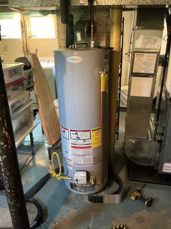 Responded to service call for Whirlpool water heater not producing hot water. Upon inspection, evaluated unit connections, gas supply line, copper piping, and overall system operation in basement utility area. Diagnosed issue, performed necessary repairs to restore hot water production, and verified proper function of water heater with no visible leaks detected at time of service.