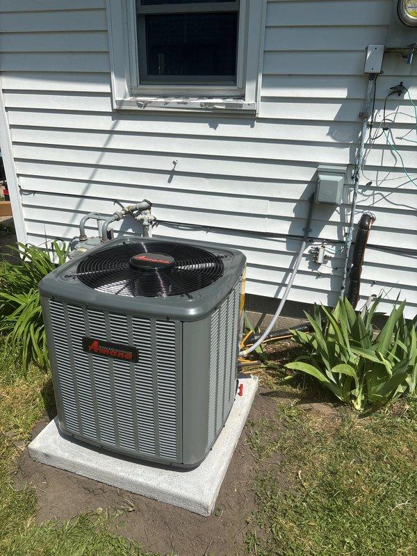 Successfully completed add-on air conditioning installation to existing forced-air heating system. Installed new Amana outdoor condensing unit on concrete pad with proper clearances from structure, connected refrigerant lines with insulation, ran electrical disconnect and power supply, and integrated evaporator coil with existing furnace in utility room. All refrigerant lines properly brazed, system evacuated, charged to manufacturer specifications, and tested for proper operation and cooling performance.