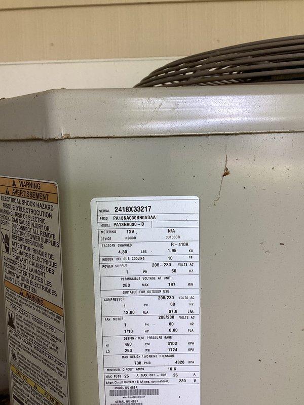 Completed annual cooling maintenance on a 28-year-old Payne split system unit, model PA13NA060BD-D. Performed comprehensive tune-up including inspection of outdoor condenser unit, refrigerant line set, and associated components. Documented equipment condition with photos showing specification nameplate, service valves, and system components for maintenance records.