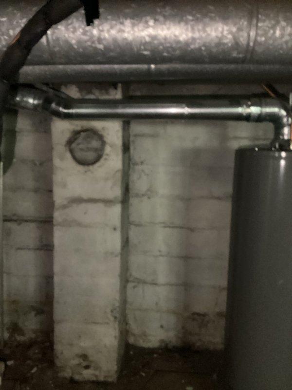 Responded to service call regarding HVAC system safety assessment related to damaged chimney ventilation. Conducted inspection of basement mechanical systems and documented existing ductwork configuration, confirming that heating and cooling equipment was previously vented through compromised chimney structure. Provided written confirmation that operating furnace or air conditioning system without proper ventilation poses safety hazard and is not recommended until alternative venting solution is installed. Photographed HVAC infrastructure including flexible aluminum ductwork, mechanical connections, and basement utility area to support documentation for insurance claim purposes.