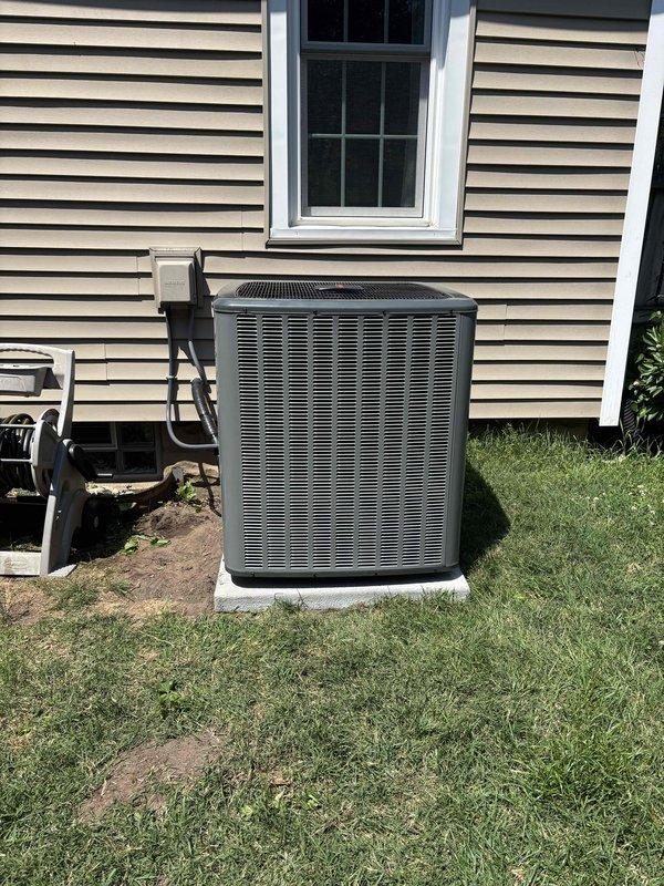Completed full HVAC system installation including outdoor condensing unit and indoor air handler/furnace. Installed new condenser on concrete pad with proper refrigerant line routing along exterior wall to electrical disconnect box. Mounted and connected indoor equipment in basement utility area with new ductwork, PVC condensate drainage, and venting system. All components tested and operational upon completion.