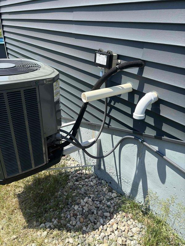 Responded to no-cooling call on 9-year-old residential air conditioning system. Customer reported unit initially failed to start at beginning of season but worked after power cycling, then failed completely and would not respond to additional power cycling attempts. Upon arrival, inspected outdoor condensing unit and electrical connections at disconnect box. Found loose wire connections at terminal block inside disconnect enclosure causing intermittent power delivery to compressor and condenser fan motor. Tightened all electrical connections at line voltage terminals, verified proper wire seating, and confirmed secure ground connection. Restored power to unit and successfully started system. Verified compressor engagement, condenser fan operation, and proper amp draw on all components. System now operating normally with reliable startup and consistent cooling performance.