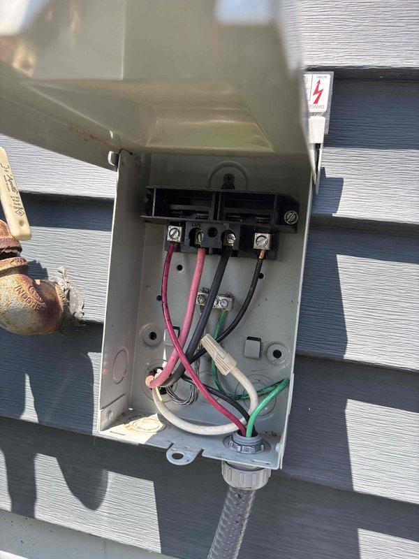 Responded to no-cooling call on 9-year-old residential air conditioning system. Customer reported unit initially failed to start at beginning of season but worked after power cycling, then failed completely and would not respond to additional power cycling attempts. Upon arrival, inspected outdoor condensing unit and electrical connections at disconnect box. Found loose wire connections at terminal block inside disconnect enclosure causing intermittent power delivery to compressor and condenser fan motor. Tightened all electrical connections at line voltage terminals, verified proper wire seating, and confirmed secure ground connection. Restored power to unit and successfully started system. Verified compressor engagement, condenser fan operation, and proper amp draw on all components. System now operating normally with reliable startup and consistent cooling performance.