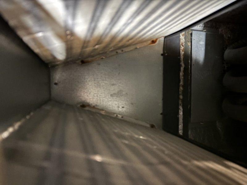 Completed comprehensive QUOTR-quoted maintenance service on refrigeration system including filter replacement and coil cleaning. Serviced outdoor condensate drain assembly and components, ensuring proper drainage function and secure connections between piping and housing unit. Performed thorough cleaning of evaporator coil and interior ductwork, removing accumulated dust and debris from all accessible surfaces to restore optimal airflow and system efficiency.