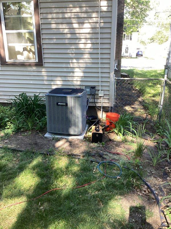 Completed full air conditioning system installation at residential property. Installed new outdoor condenser unit on existing concrete pad with proper clearances from structure and positioned for optimal airflow. Connected refrigerant lines and electrical service to condenser. Inside mechanical room, installed or connected indoor air handler unit with associated drainage piping and verified proper integration with existing furnace system. Tested system operation, confirmed proper refrigerant charge, verified electrical connections, and ensured all components functioning within manufacturer specifications.