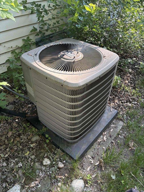 Completed comprehensive AC tune-up service on outdoor condensing unit of unknown age and brand. Performed thorough inspection of system components, cleaned heavily soiled electronic control board showing significant dirt and debris accumulation with white residue buildup, and verified proper operation of all accessible components including fan motor and condenser coil. Unit operational upon completion with all safety checks passed.