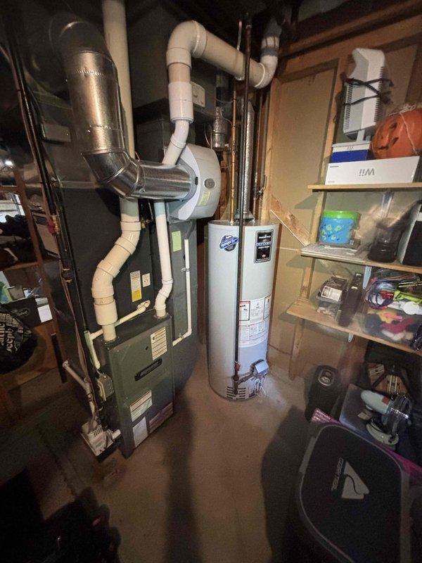 Completed annual cooling maintenance inspection on EnergiAir system as part of 4-year service agreement. Performed comprehensive tune-up procedures including system diagnostics, refrigerant level verification, electrical component testing, and condenser coil inspection. All equipment operating within normal parameters; documented installation with photos showing furnace, water heater, and associated HVAC components in mechanical room.