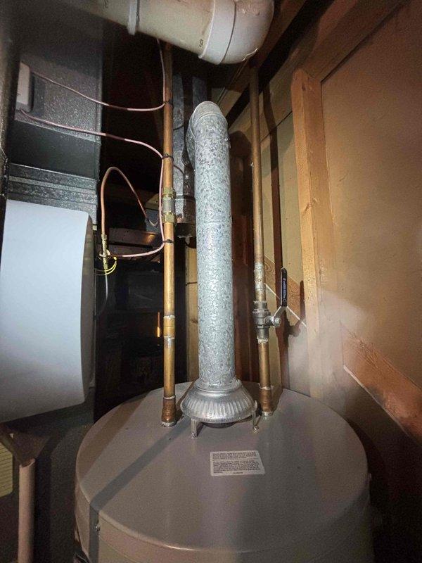 Completed annual cooling maintenance inspection on EnergiAir system as part of 4-year service agreement. Performed comprehensive tune-up procedures including system diagnostics, refrigerant level verification, electrical component testing, and condenser coil inspection. All equipment operating within normal parameters; documented installation with photos showing furnace, water heater, and associated HVAC components in mechanical room.