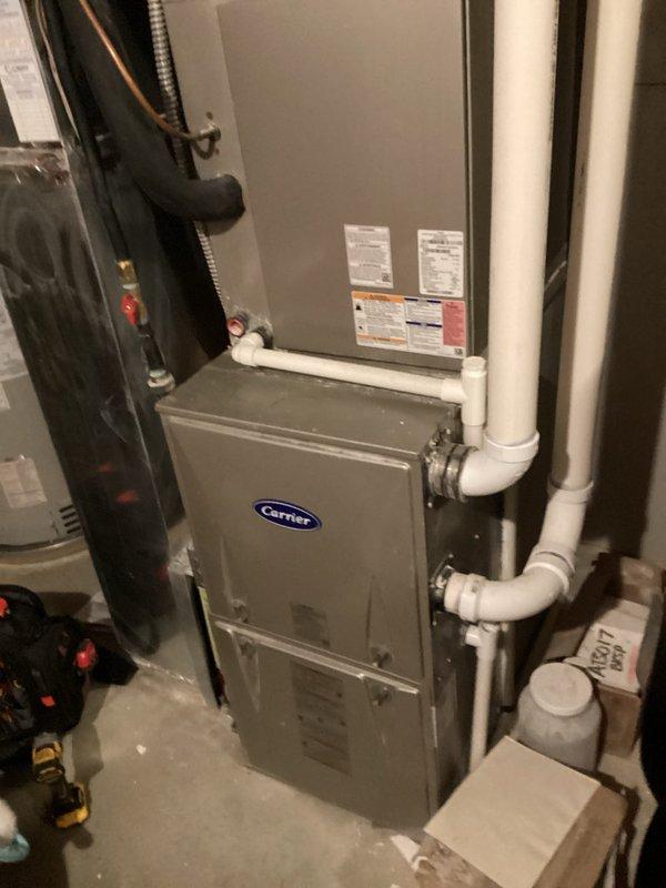 Completed annual cooling maintenance on 7-year-old Carrier HVAC system. Inspected evaporator coil assembly and confirmed proper fin condition and cleanliness, verified furnace operation and drainage system functionality, and documented equipment condition with no immediate repairs required.