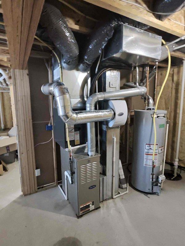 Completed full air conditioning system replacement in basement mechanical room. Installed new AC unit with proper refrigerant line connections to existing furnace system, ensuring seamless integration with forced-air heating infrastructure. Verified all ductwork connections, electrical wiring, and condensate drainage for optimal system performance and code compliance.