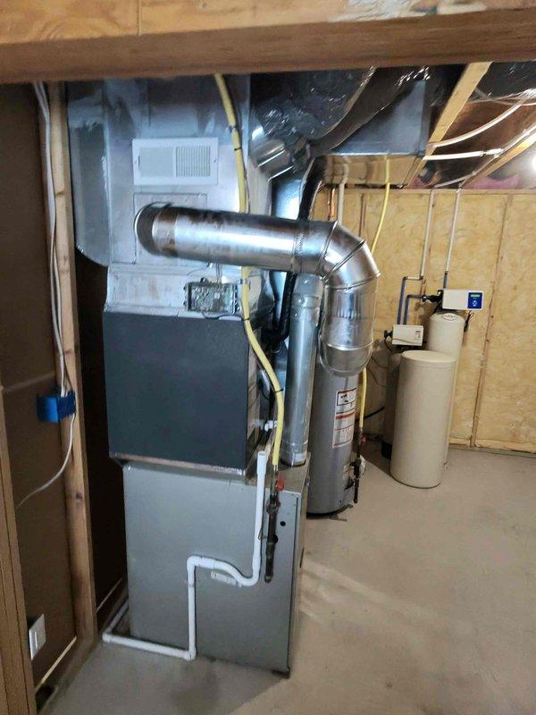 Completed full air conditioning system replacement in basement mechanical room. Installed new AC unit with proper refrigerant line connections to existing furnace system, ensuring seamless integration with forced-air heating infrastructure. Verified all ductwork connections, electrical wiring, and condensate drainage for optimal system performance and code compliance.