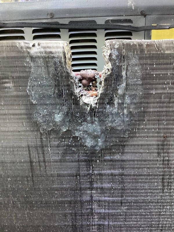 Returned to site to complete quoted condenser coil repair. Upon inspection, confirmed extensive corrosion damage to the condenser coil with compromised refrigerant tubing and deteriorated fin sections. The unit exhibited severe oxidation with a large corroded cavity penetrating through multiple layers of the coil assembly, along with torn copper refrigerant lines showing exposed metal and damaged insulation material.

Performed complete condenser coil replacement to restore system functionality. Removed damaged coil assembly and installed new condenser coil unit. Reconnected refrigerant lines with proper brazing techniques and installed new line insulation. Verified all connections for integrity and proper fitment. System restored to operational condition.