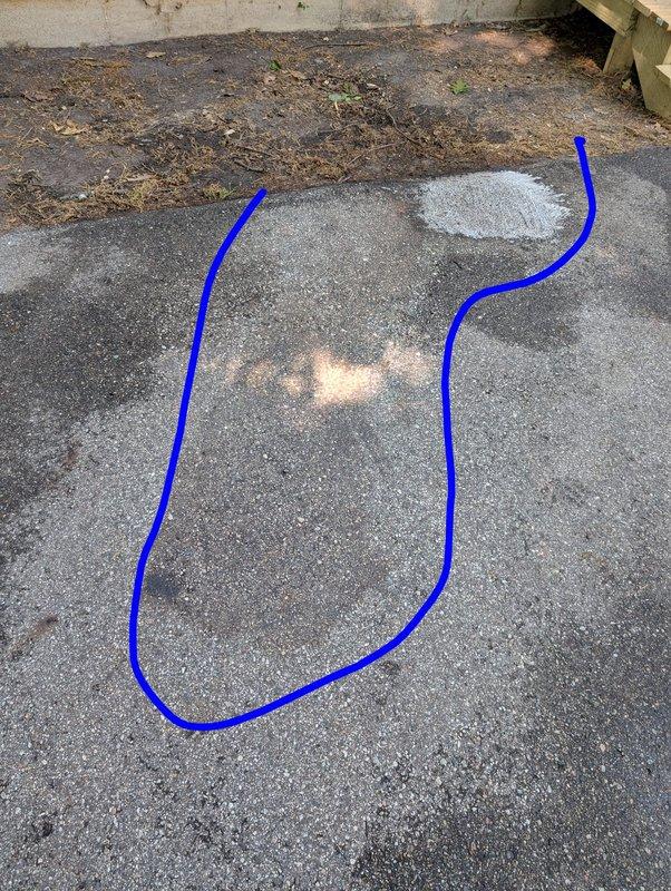 Responded to a no-charge service call to assess concrete staining on an exterior paved surface. Upon arrival, inspected the concrete driveway/patio area which exhibited weathering, discoloration, and various surface stains typical of aged outdoor concrete. Documented the existing conditions with photographs showing multiple lighter patches and darker spots across the gray surface, along with accumulated debris at the transition point between the concrete and adjacent soil area. Provided professional assessment and recommendations to the customer regarding stain removal options for the affected concrete surface.