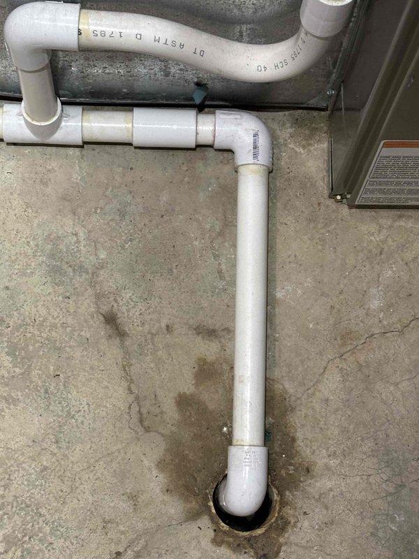 Completed annual cooling maintenance on 6-year-old EcoAir system. Performed standard tune-up procedures including system inspection, performance testing, and documentation with photos of condensate drain system showing PVC piping and drainage components in proper working condition.