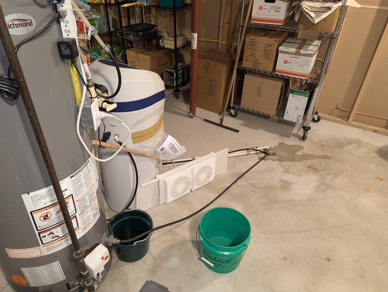 Provided estimate for replacement of existing eight-year-old Rheem water heater in residential basement location. Assessed current installation including pump system with PVC and insulated piping configuration, confirmed unit specifications and reviewed mechanical room layout for replacement planning. Customer requested quote for new water heater installation to replace aging unit.