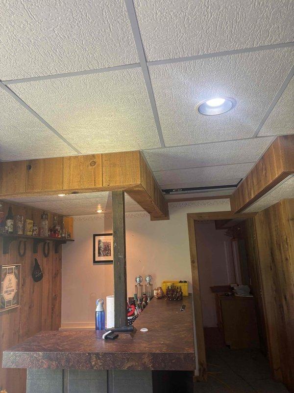 Installed new natural gas line to upstairs kitchen for stove conversion from electric to natural gas, including stub-up behind stove location. Additionally installed gas rough-in piping for future water heater conversion from electric to natural gas tankless system.