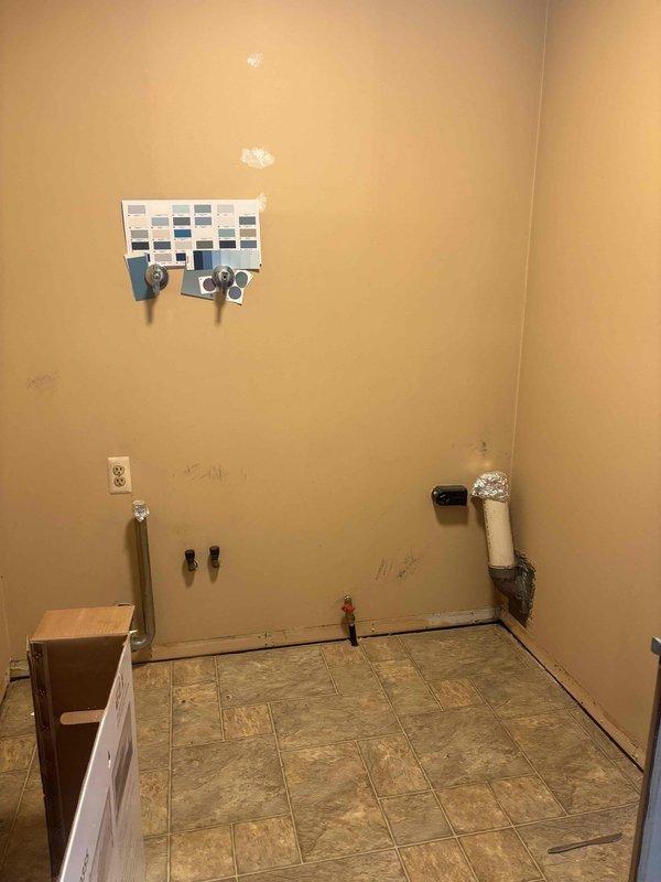 Installed new natural gas line to upstairs kitchen for stove conversion from electric to natural gas, including stub-up behind stove location. Additionally installed gas rough-in piping for future water heater conversion from electric to natural gas tankless system.