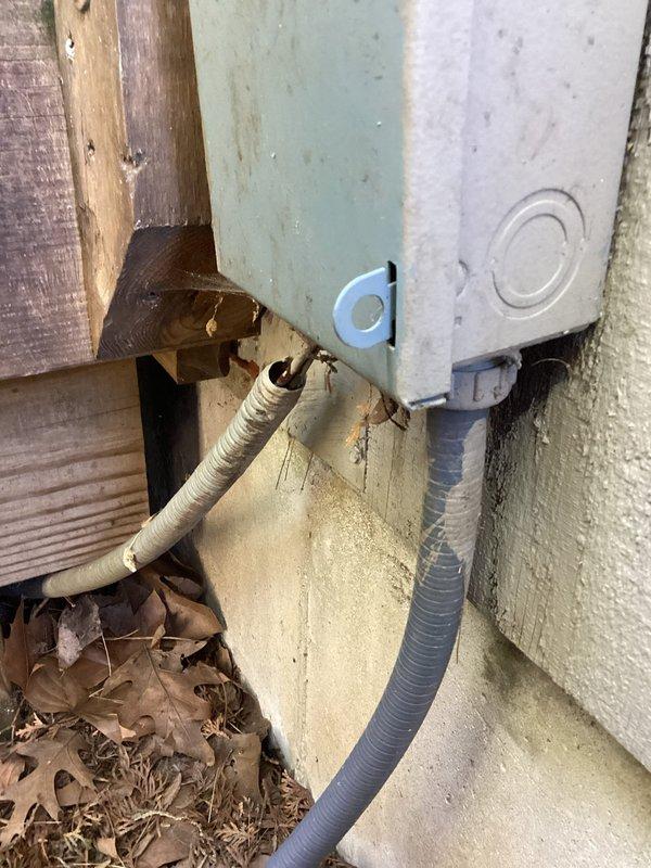 Completed annual cooling maintenance on 18-year-old air conditioning system. Performed comprehensive tune-up including inspection of outdoor unit, refrigerant lines, and electrical connections. Observed weathered line set insulation and debris accumulation around exterior equipment; noted conduit routing and general outdoor component condition for future monitoring.