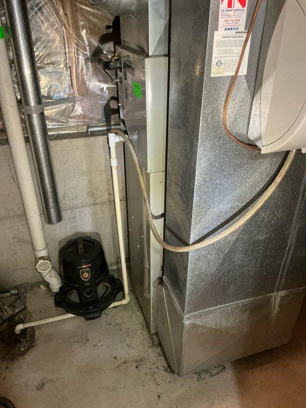 Conducted equipment assessment and provided estimate for complete HVAC system replacement at single-family residential property. Evaluated existing 24-25 year old furnace and air conditioning system located in basement utility area. Documented current equipment configuration including furnace with copper refrigerant lines, PVC condensate drain system, existing ductwork, and associated HVAC components. Photographed equipment specifications, manufacturer labels, and installation layout to provide accurate replacement recommendations. No active system failures reported; assessment performed at homeowner's request for equipment upgrade planning purposes.